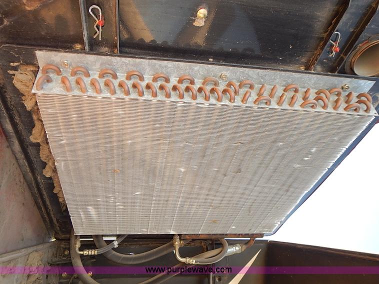 image for item J2239 2003 New Holland HW320 self-propelled swather