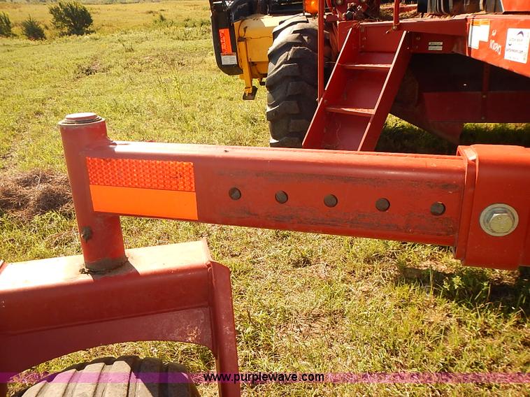 image for item J2239 2003 New Holland HW320 self-propelled swather