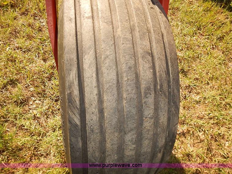 image for item J2239 2003 New Holland HW320 self-propelled swather