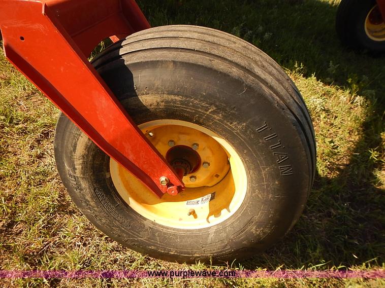 image for item J2239 2003 New Holland HW320 self-propelled swather