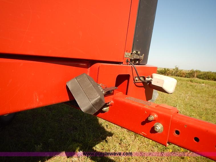 image for item J2239 2003 New Holland HW320 self-propelled swather