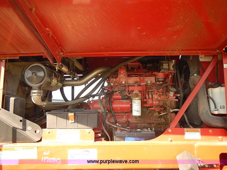 image for item J2239 2003 New Holland HW320 self-propelled swather