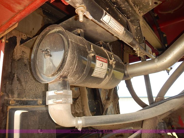 image for item J2239 2003 New Holland HW320 self-propelled swather