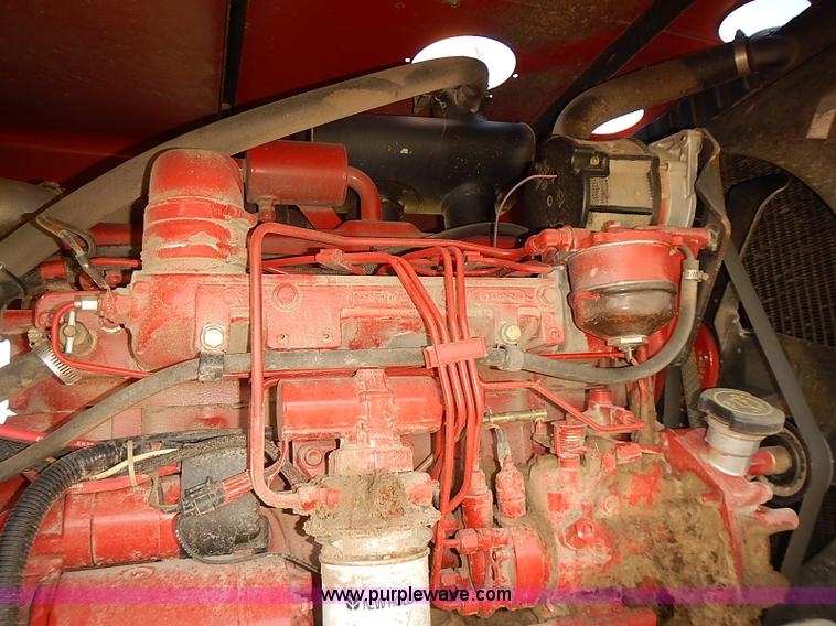 image for item J2239 2003 New Holland HW320 self-propelled swather