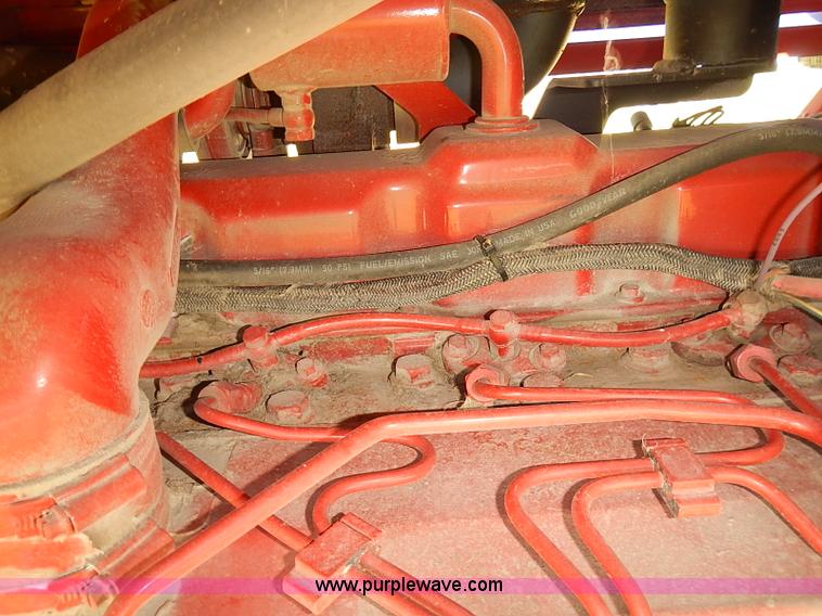 image for item J2239 2003 New Holland HW320 self-propelled swather