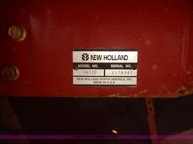 image for item J2239 2003 New Holland HW320 self-propelled swather