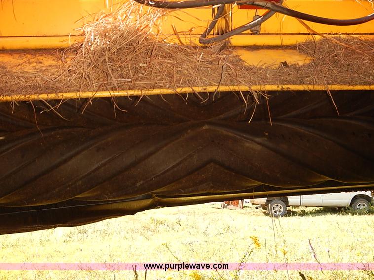 image for item J2239 2003 New Holland HW320 self-propelled swather