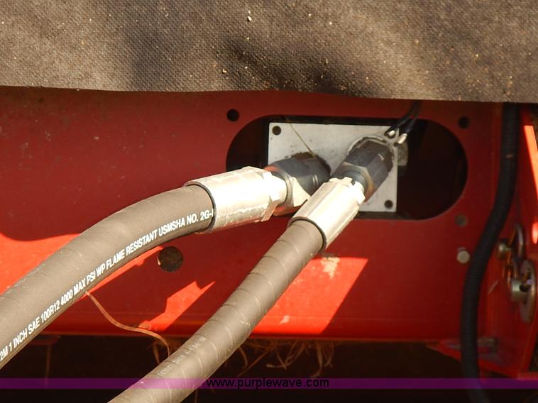 image for item J2239 2003 New Holland HW320 self-propelled swather