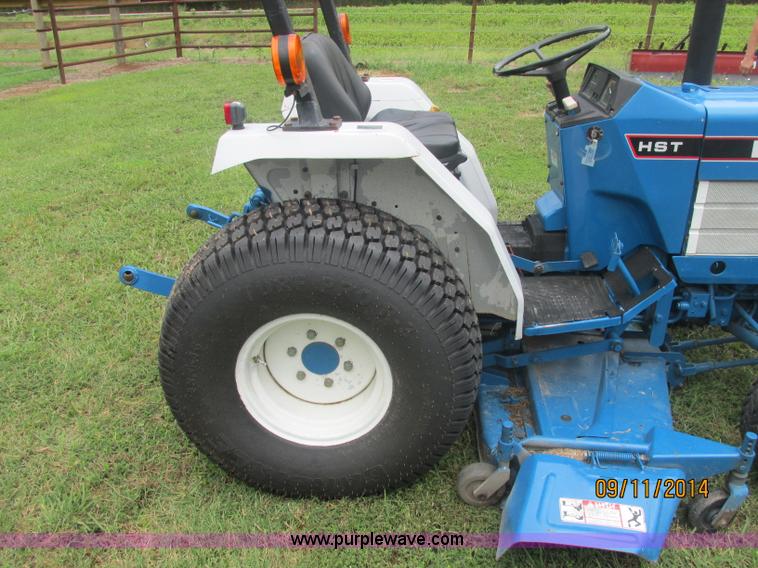 image for item J2414 Ford 1320 MFWD tractor