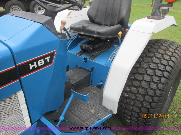 image for item J2414 Ford 1320 MFWD tractor