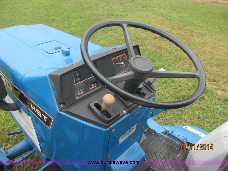 image for item J2414 Ford 1320 MFWD tractor