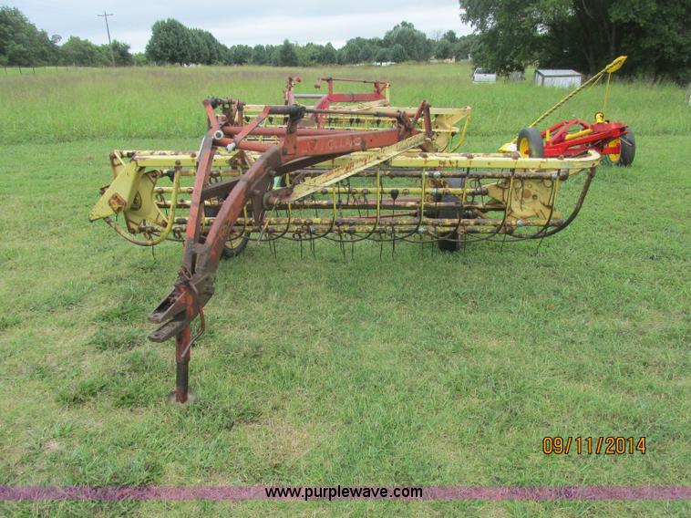 image for item J2422 New Holland 256 roll bar hay rake
