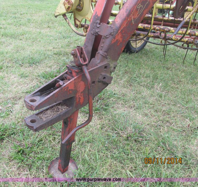 image for item J2422 New Holland 256 roll bar hay rake
