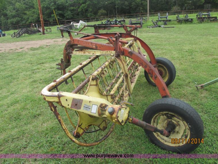 image for item J2422 New Holland 256 roll bar hay rake