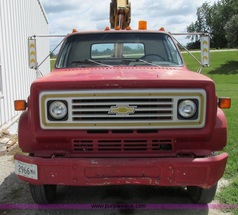 image for item G9097 1984 Chevrolet 60 flatbed truck with backhoe attachment