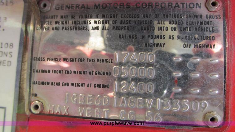 image for item G9097 1984 Chevrolet 60 flatbed truck with backhoe attachment