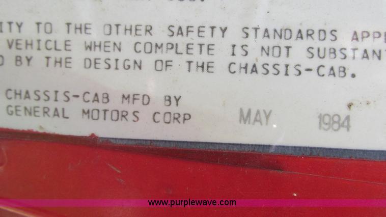 image for item G9097 1984 Chevrolet 60 flatbed truck with backhoe attachment