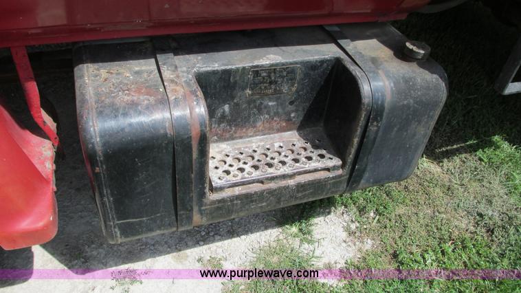 image for item G9097 1984 Chevrolet 60 flatbed truck with backhoe attachment