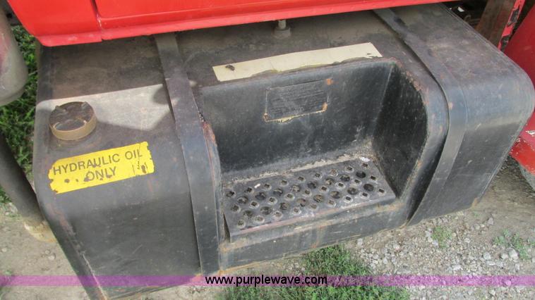 image for item G9097 1984 Chevrolet 60 flatbed truck with backhoe attachment