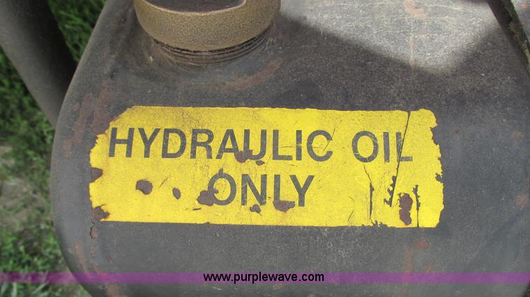 image for item G9097 1984 Chevrolet 60 flatbed truck with backhoe attachment