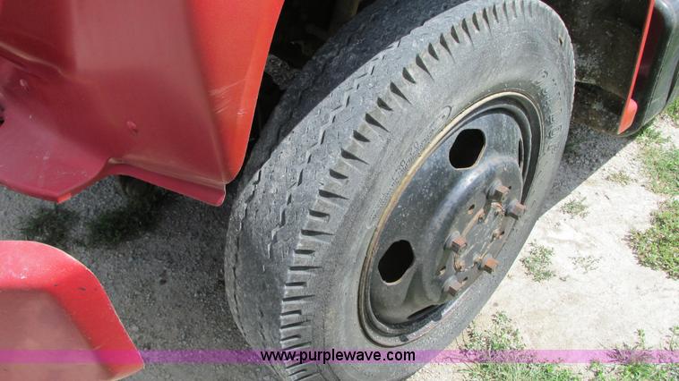 image for item G9097 1984 Chevrolet 60 flatbed truck with backhoe attachment