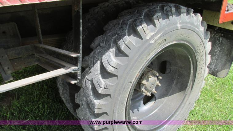 image for item G9097 1984 Chevrolet 60 flatbed truck with backhoe attachment