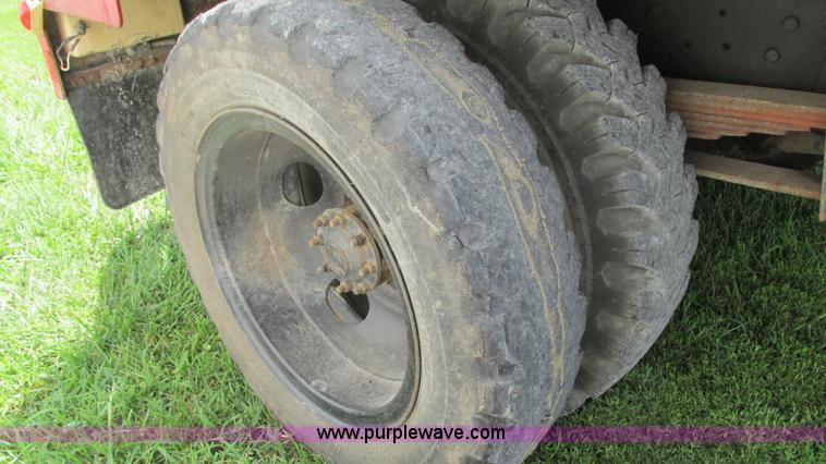 image for item G9097 1984 Chevrolet 60 flatbed truck with backhoe attachment