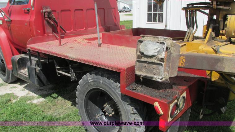 image for item G9097 1984 Chevrolet 60 flatbed truck with backhoe attachment