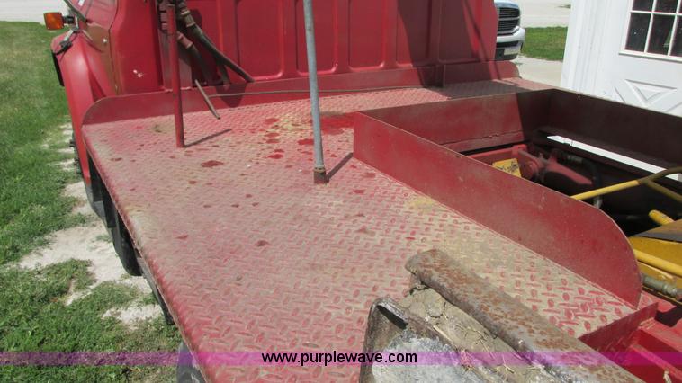 image for item G9097 1984 Chevrolet 60 flatbed truck with backhoe attachment