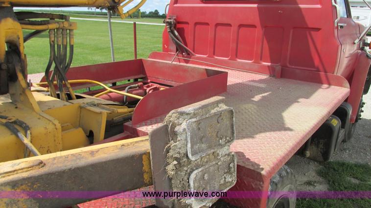 image for item G9097 1984 Chevrolet 60 flatbed truck with backhoe attachment