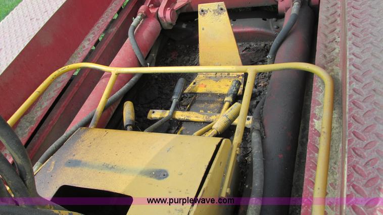 image for item G9097 1984 Chevrolet 60 flatbed truck with backhoe attachment