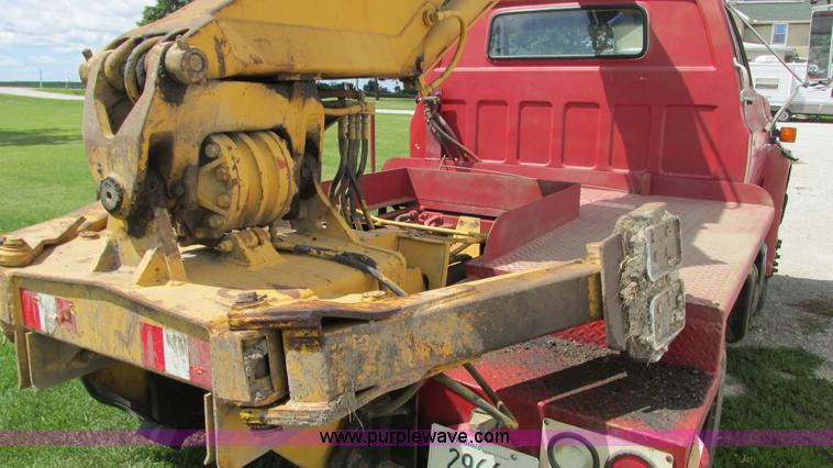 image for item G9097 1984 Chevrolet 60 flatbed truck with backhoe attachment