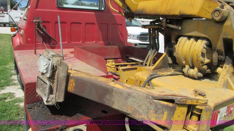 image for item G9097 1984 Chevrolet 60 flatbed truck with backhoe attachment