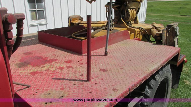 image for item G9097 1984 Chevrolet 60 flatbed truck with backhoe attachment