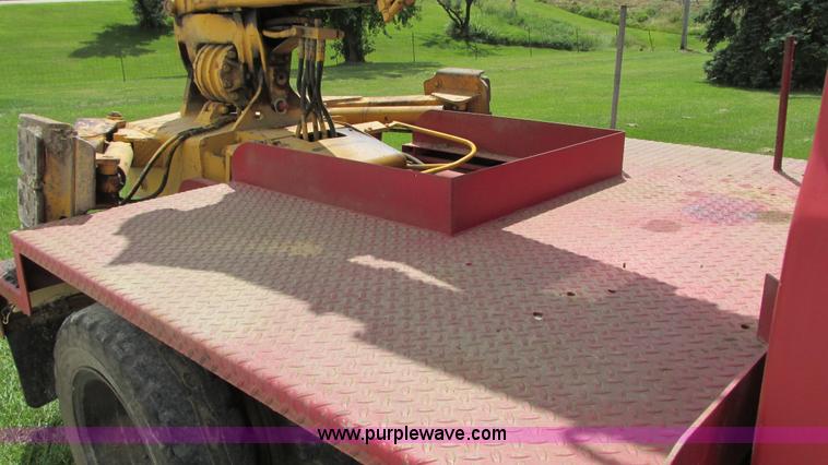 image for item G9097 1984 Chevrolet 60 flatbed truck with backhoe attachment