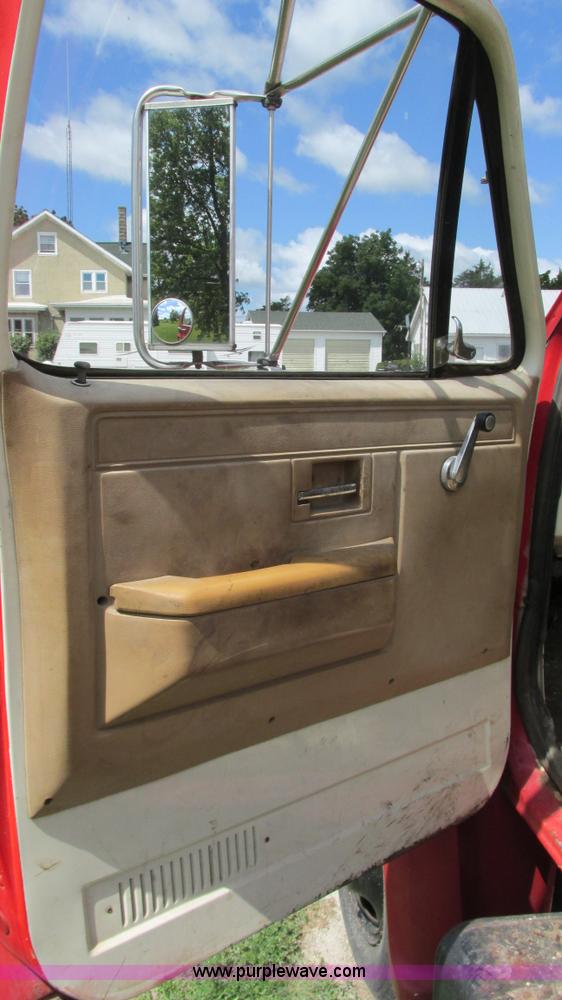 image for item G9097 1984 Chevrolet 60 flatbed truck with backhoe attachment