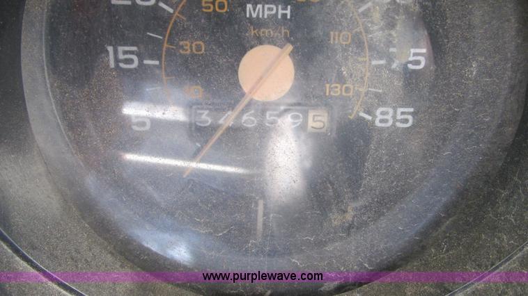 image for item G9097 1984 Chevrolet 60 flatbed truck with backhoe attachment