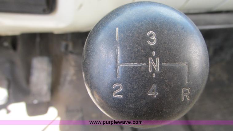 image for item G9097 1984 Chevrolet 60 flatbed truck with backhoe attachment