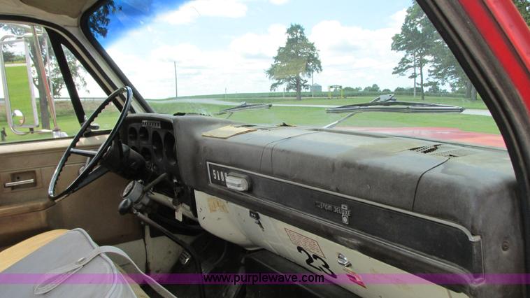 image for item G9097 1984 Chevrolet 60 flatbed truck with backhoe attachment