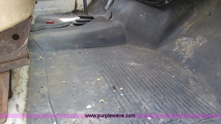 image for item G9097 1984 Chevrolet 60 flatbed truck with backhoe attachment