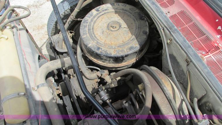 image for item G9097 1984 Chevrolet 60 flatbed truck with backhoe attachment