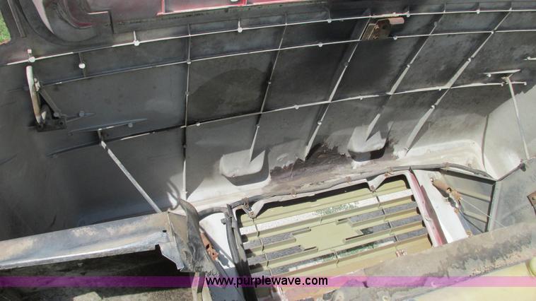 image for item G9097 1984 Chevrolet 60 flatbed truck with backhoe attachment