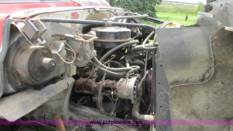 image for item G9097 1984 Chevrolet 60 flatbed truck with backhoe attachment