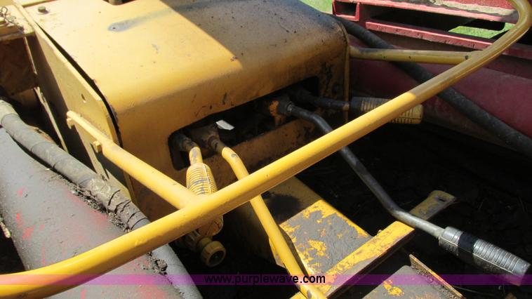 image for item G9097 1984 Chevrolet 60 flatbed truck with backhoe attachment