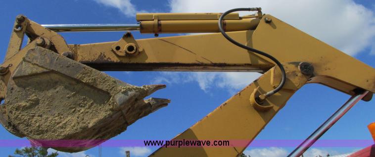 image for item G9097 1984 Chevrolet 60 flatbed truck with backhoe attachment