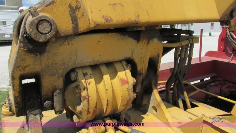 image for item G9097 1984 Chevrolet 60 flatbed truck with backhoe attachment