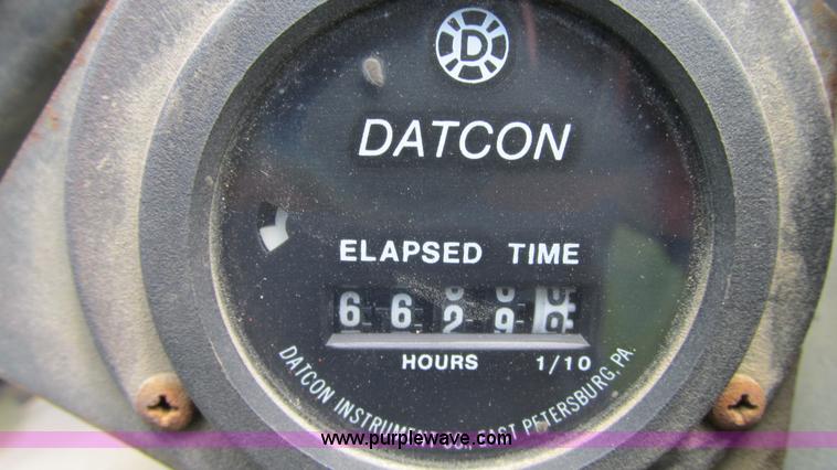 image for item G9097 1984 Chevrolet 60 flatbed truck with backhoe attachment