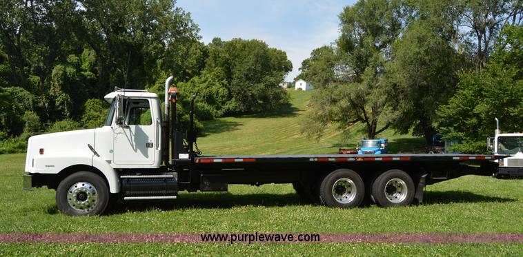 image for item H2873 1999 Volvo WG rollback truck