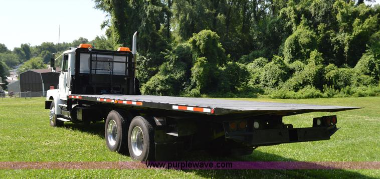 image for item H2873 1999 Volvo WG rollback truck