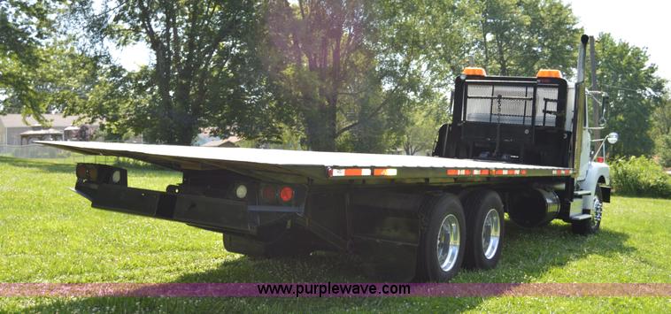 image for item H2873 1999 Volvo WG rollback truck